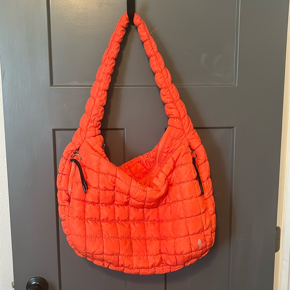 Free People quilted carryall bag in a pretty red/orange color.